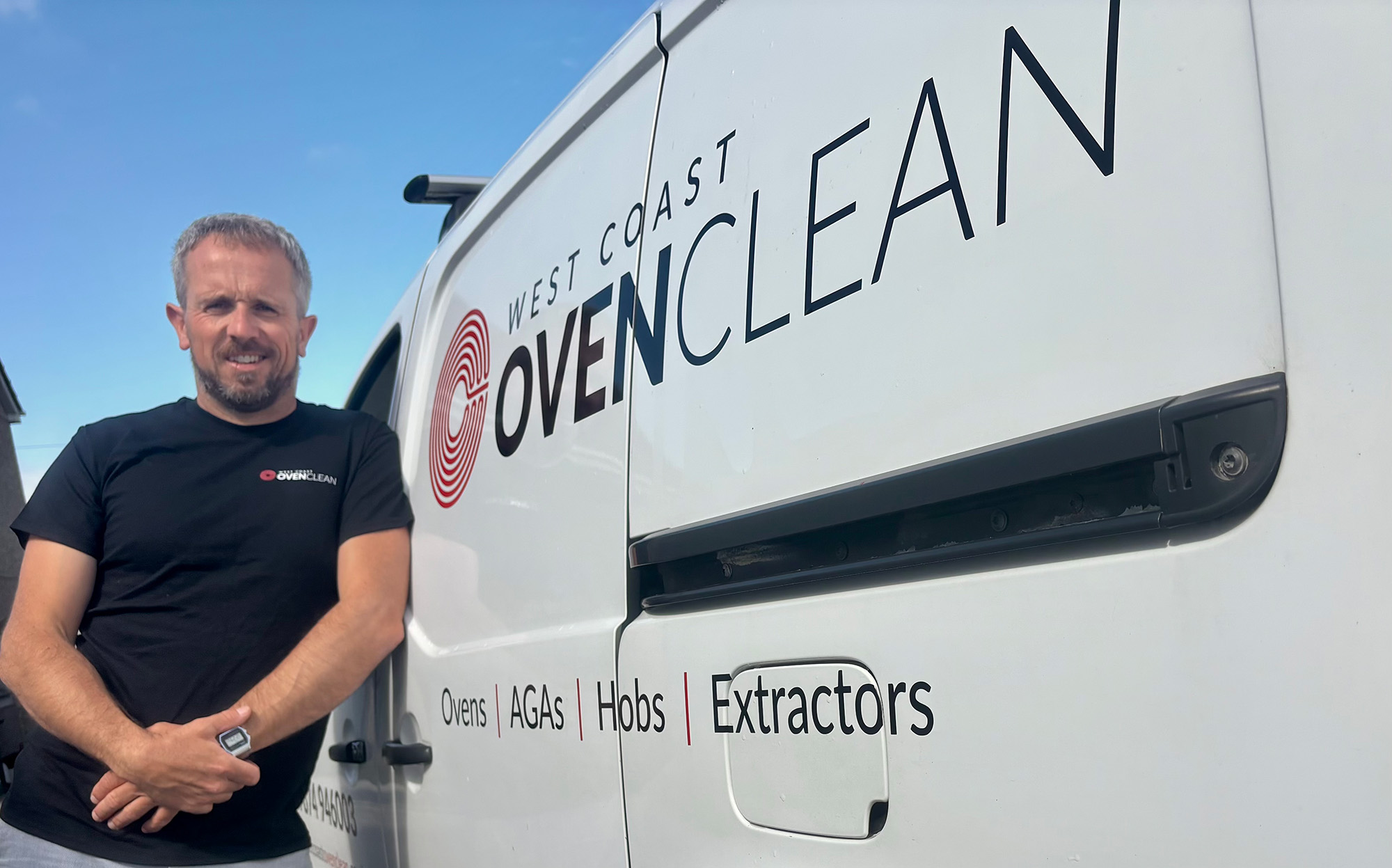 Matthew stood next to his work van, sign written with the West Coast Oven Clean details